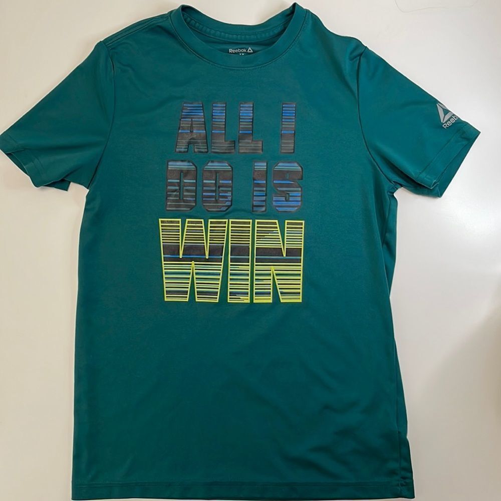Reebok short sleeve T-shirt. Breathable light weight sport material. Size Medium